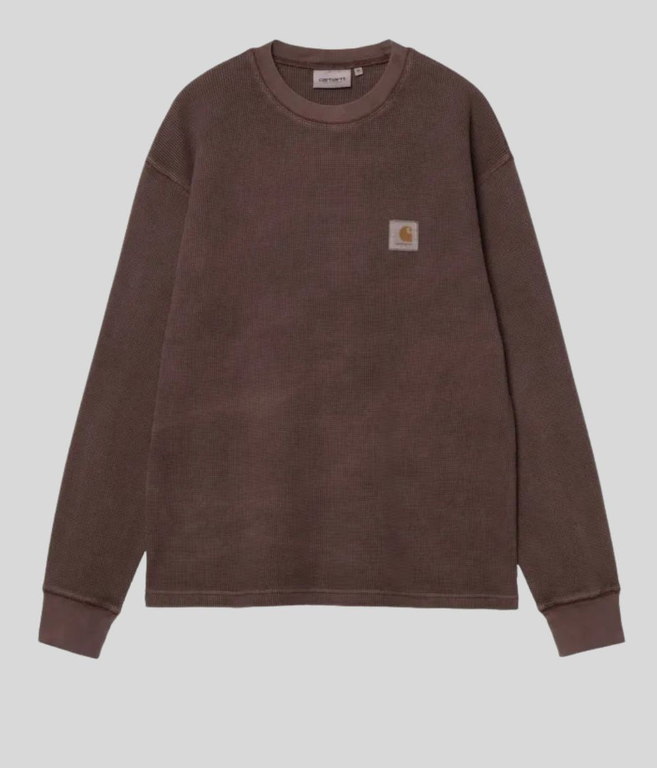 A brown Carhartt crewneck sweatshirt with a small signature chest patch, displayed flat against a light gray background.