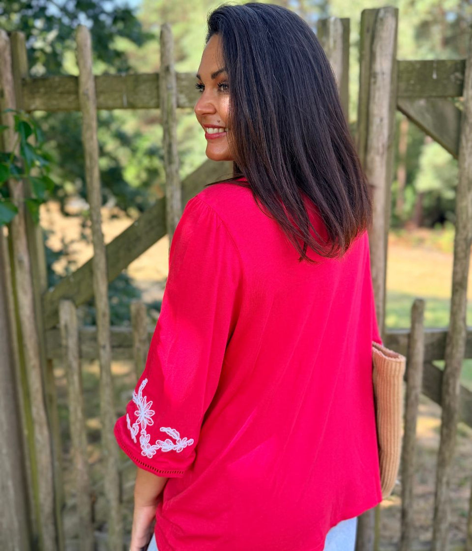 Raspberry Embroidered V Neck Top