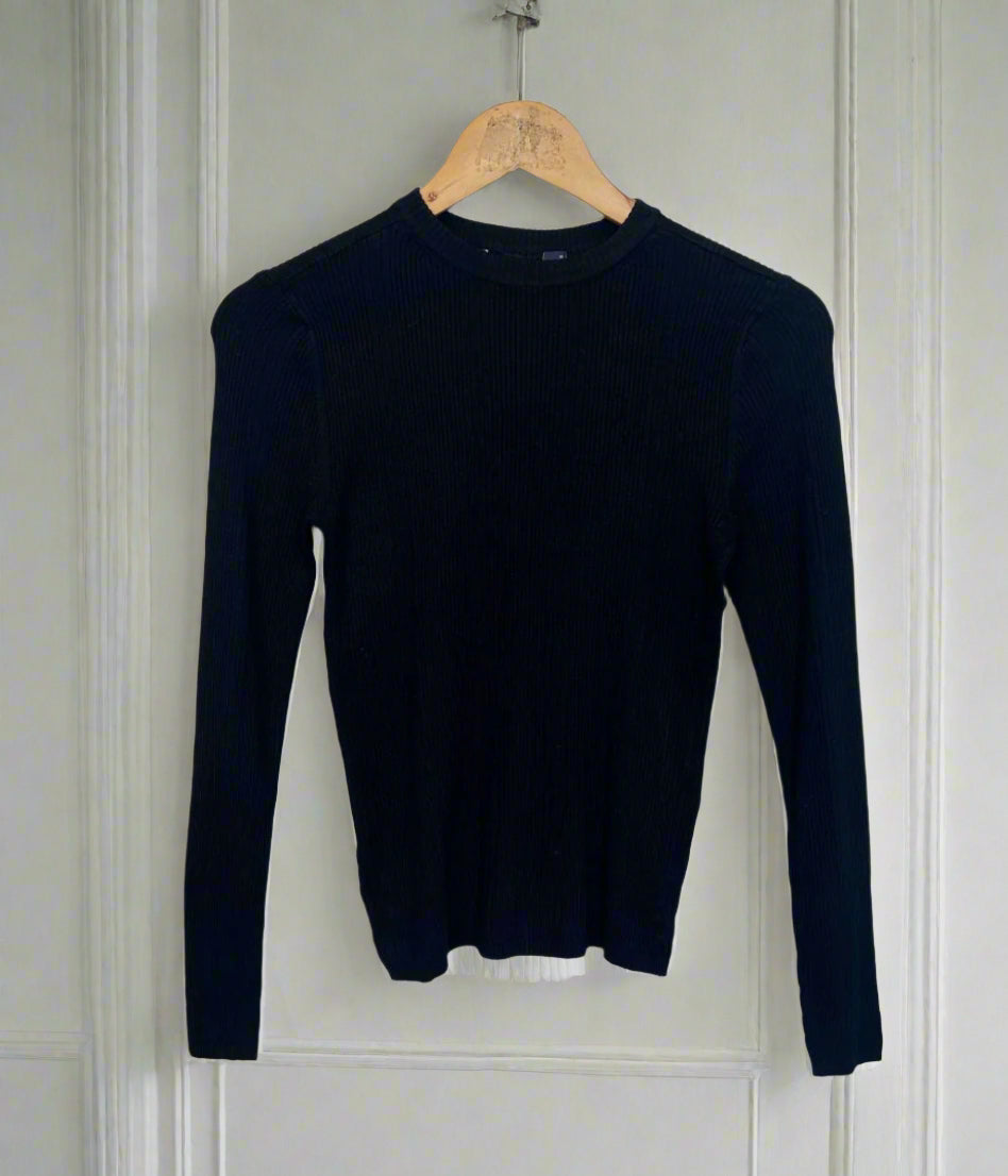 Black long-sleeve shirt on a hanger against a white background