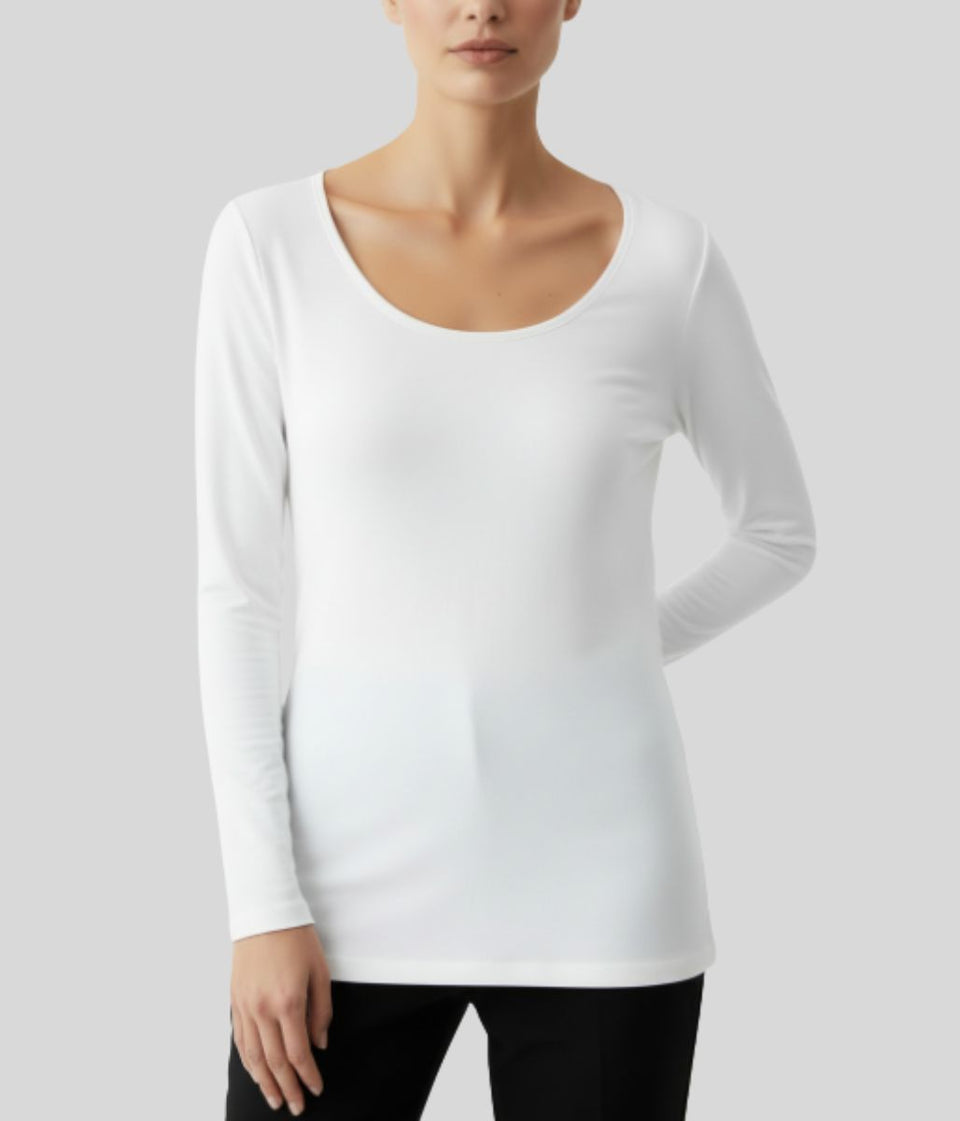 White long-sleeve top worn by a person on a light gray background